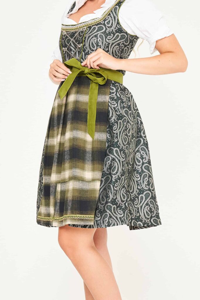 Woman in dark grey paisley Dirndl with olive green checkered apron. - Lederhosen For Sale
