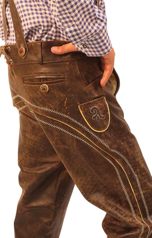 Side view close-up of brown embroidered Bundhosen with hand in pocket - Lederhosen For Sale