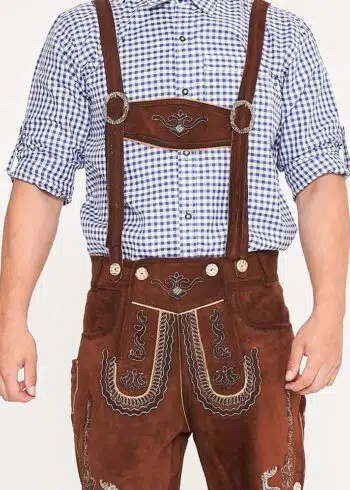Man standing in shaded brown Lederhosen with checkered shirt. - Lederhosen For Sale