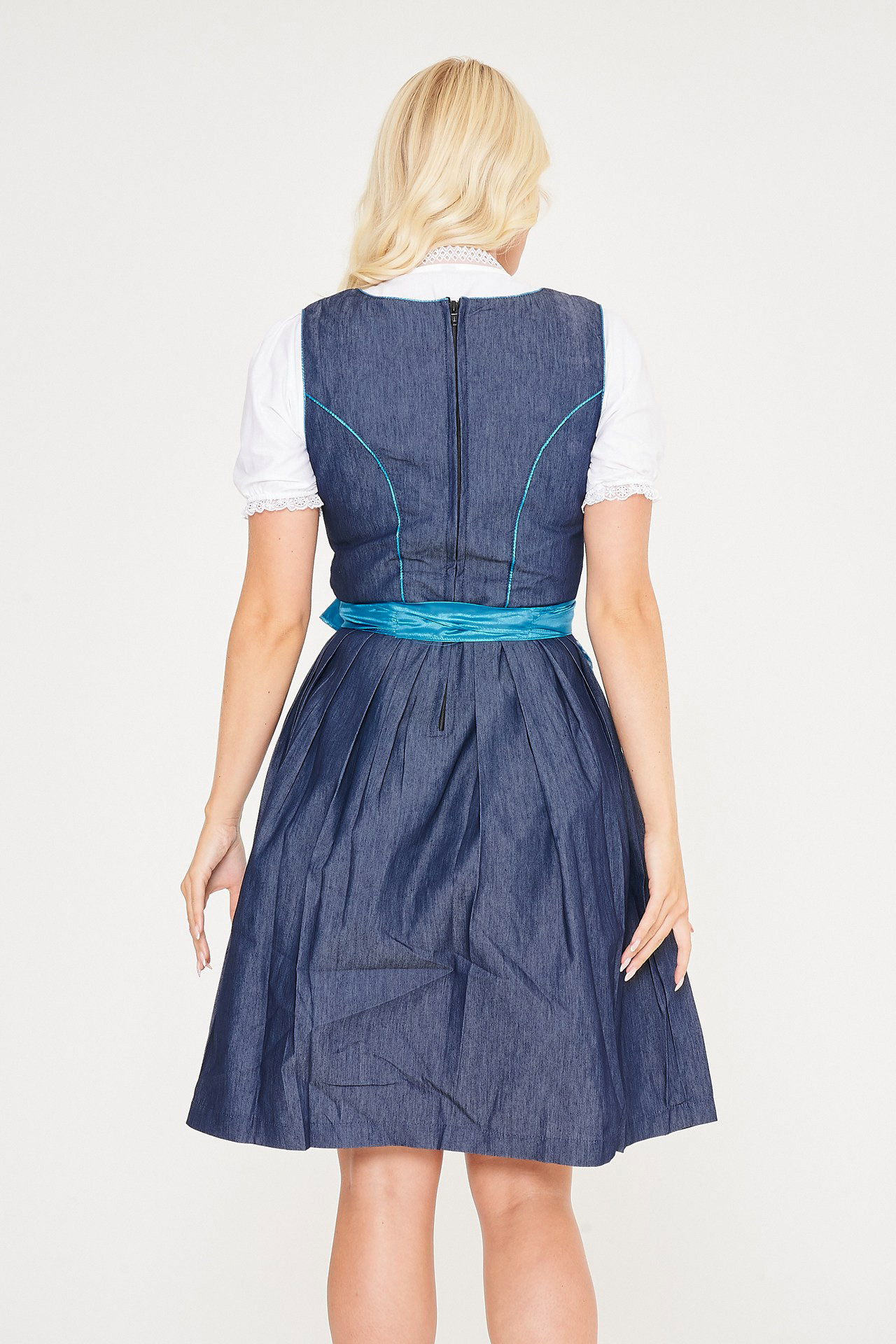 Back view of blonde woman in blue denim Dirndl. - Lederhosen For Sale