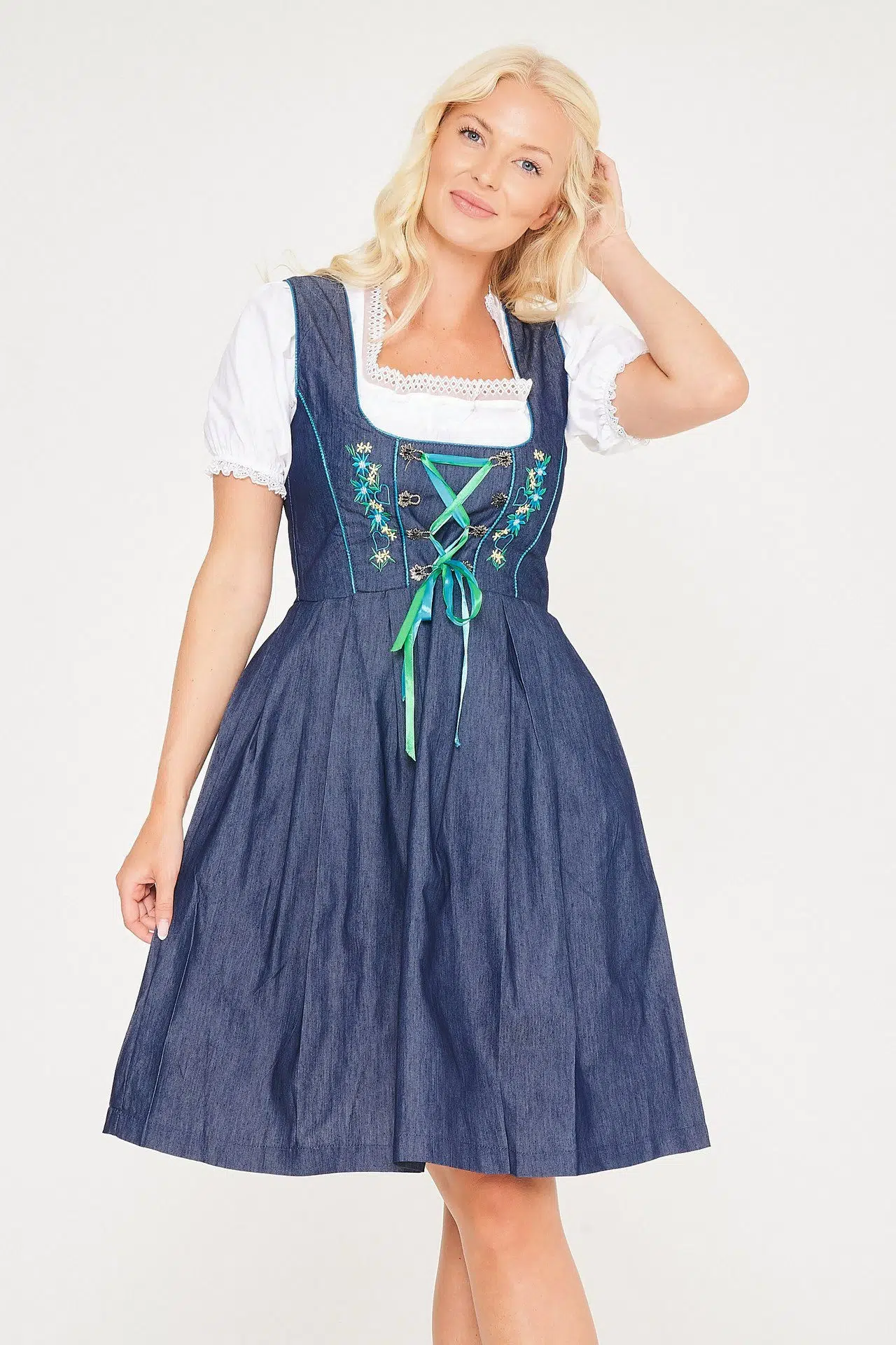 Blonde woman smiling in blue denim Erna midi Dirndl. - Lederhosen For Sale