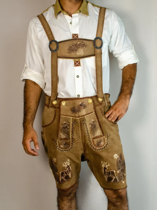 Front view of man in tan embroidered Lederhosen with deer motifs and white shirt. - Lederhosen For Sale