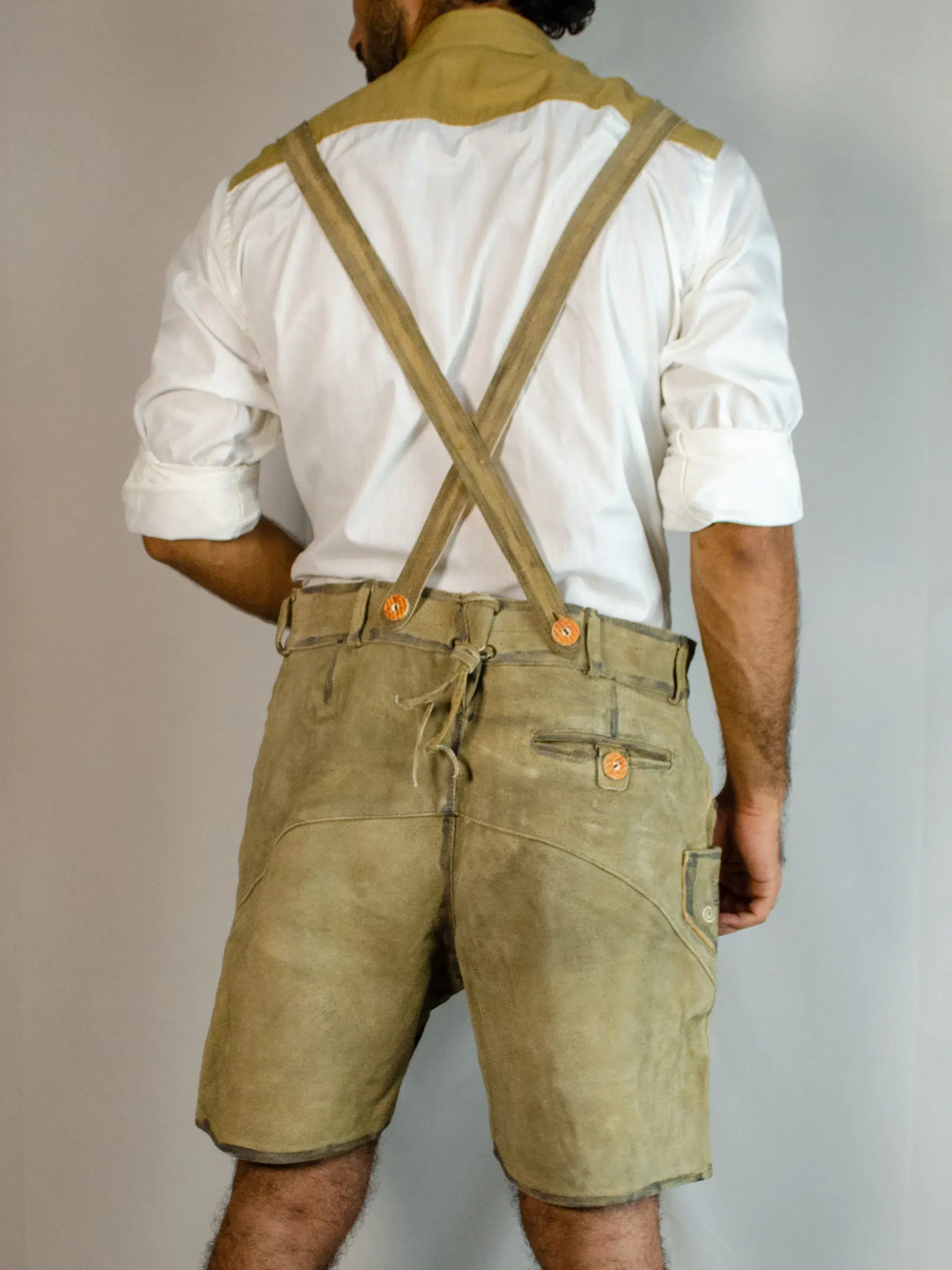 Back view of man in shaded brown Trachten Lederhosen. - Lederhosen For Sale